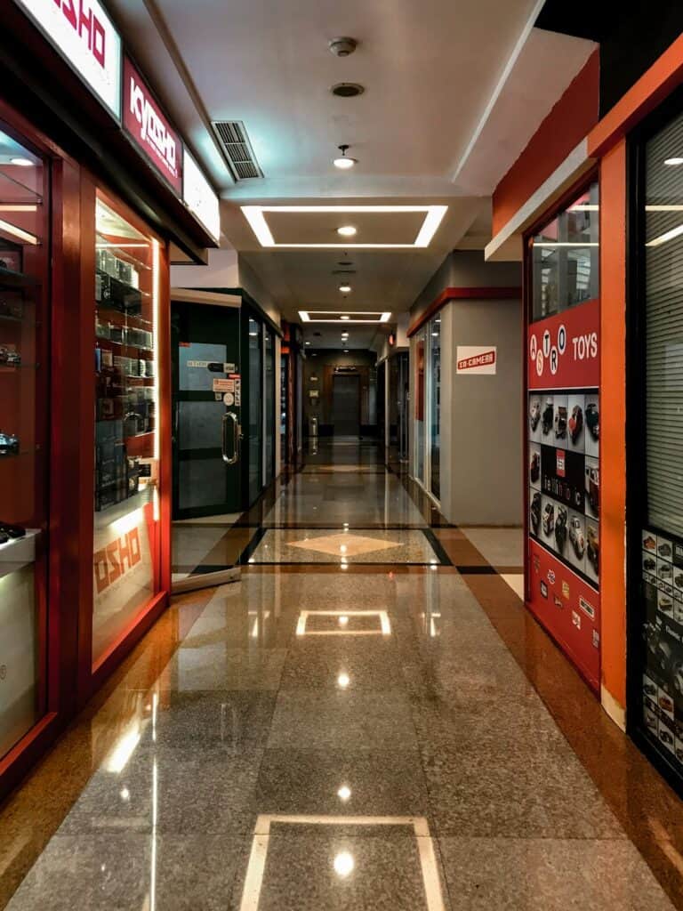 Vape Shop Interior With Vending Machines And Shopping Area Promoting Electronic Cigarettes And Accessories.