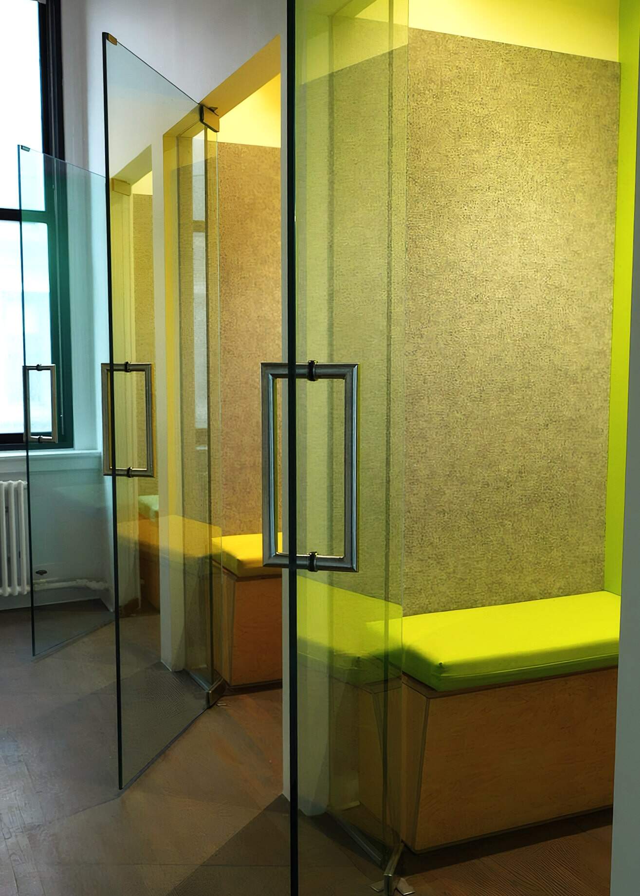 Modern Glass Office Partition With Green And Yellow Accents, Contemporary Interior Design, Custom Workplace Solutions For Business Interiors, Joining American Builders Expertise.